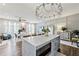 Open concept living area with a large kitchen island and views into the comfortable living space at 560 Dutch Valley Ne Rd # 2207, Atlanta, GA 30324