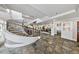Grand lobby with spiral staircase, slate floors, and comfortable seating, offering a luxurious welcome at 560 Dutch Valley Ne Rd # 2207, Atlanta, GA 30324