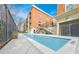 Inviting in-ground pool surrounded by community buildings, offering a refreshing outdoor space at 560 Dutch Valley Ne Rd # 2207, Atlanta, GA 30324