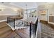 Bright staircase with a large window, hardwood steps and dark metal railing, and a contemporary light fixture at 560 Dutch Valley Ne Rd # 2207, Atlanta, GA 30324
