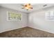 Bedroom featuring carpeted floors, neutral walls, and two windows for ample natural light at 2830 Knollview Dr, Decatur, GA 30034