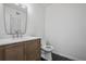 Elegant powder room featuring hexagon tile floors and granite vanity at 3144 Corner Oak Dr, Norcross, GA 30071
