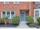 Brick townhome featuring landscaping, and walkway to the front door at 3144 Corner Oak Dr, Norcross, GA 30071