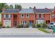 Brick townhome with landscaping, driveway and street view at 3144 Corner Oak Dr, Norcross, GA 30071
