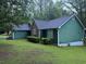 Charming home with well-maintained landscaping, dark-shingled roof and stylish brick accents at 608 Fairhaven Blvd, Stockbridge, GA 30281