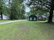 Well-maintained front yard with mature trees and landscaping at 608 Fairhaven Blvd, Stockbridge, GA 30281