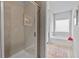 This bathroom features an enclosed tiled shower, a soaking tub, and a neutral color palette at 14 Jacobs Farm Ln # 7, Lawrenceville, GA 30045