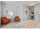 This bright bedroom features art pieces on the wall, two comfy chairs and carpeted floors at 14 Jacobs Farm Ln # 7, Lawrenceville, GA 30045