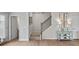 Inviting entryway featuring wood floors, staircase, and tasteful decorations at 14 Jacobs Farm Ln # 7, Lawrenceville, GA 30045