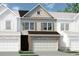 Charming townhome features a brick facade and a two-car garage at 14 Jacobs Farm Ln # 7, Lawrenceville, GA 30045