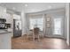 Bright kitchen with stainless steel appliances, white cabinets, and a view to a dining area at 14 Jacobs Farm Ln # 7, Lawrenceville, GA 30045
