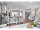 Open concept kitchen featuring an island with seating, wood floors, and modern fixtures at 14 Jacobs Farm Ln # 7, Lawrenceville, GA 30045