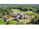 Aerial view of a club house surrounded by a golf course at 1409 Spyglass Hill Dr, Johns Creek, GA 30097