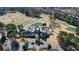 Aerial view of a clubhouse and golf course surrounded by a residential neighborhood at 1409 Spyglass Hill Dr, Johns Creek, GA 30097