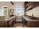 Elegant wet bar featuring granite countertop, wine rack, and natural light from windows at 1409 Spyglass Hill Dr, Johns Creek, GA 30097