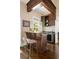 Stylish wet bar with granite countertop, wine storage, and seating area at 1409 Spyglass Hill Dr, Johns Creek, GA 30097