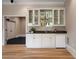 The sleek bar area is equipped with a sink and mini-fridge at 1409 Spyglass Hill Dr, Johns Creek, GA 30097