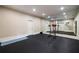 Basement home gym with floor-to-ceiling mirrors and ample open space at 1409 Spyglass Hill Dr, Johns Creek, GA 30097