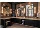 Well-lit bathroom featuring double sinks with decorative mirrors and ample cabinet space at 1409 Spyglass Hill Dr, Johns Creek, GA 30097