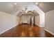 Spacious bonus room with vaulted ceiling and hardwood flooring at 1409 Spyglass Hill Dr, Johns Creek, GA 30097