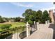 Private deck offering beautiful views of the golf course and surrounding landscape at 1409 Spyglass Hill Dr, Johns Creek, GA 30097