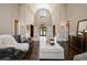 Grand foyer featuring high ceilings, elegant decor, and plenty of natural light at 1409 Spyglass Hill Dr, Johns Creek, GA 30097
