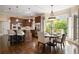 Eat-in kitchen featuring custom cabinets, stainless appliances, and a cozy breakfast nook at 1409 Spyglass Hill Dr, Johns Creek, GA 30097