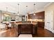 Spacious kitchen features a large central island with cooktop and seating at 1409 Spyglass Hill Dr, Johns Creek, GA 30097