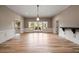 Expansive living room with light wood floors and French doors leading to outdoor views at 1409 Spyglass Hill Dr, Johns Creek, GA 30097
