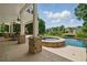 Covered patio with a built-in jacuzzi and a swimming pool at 1409 Spyglass Hill Dr, Johns Creek, GA 30097