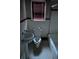 Bathroom with vintage fixtures, including a pedestal sink and tiled floors at 1643 Westhaven Sw Dr, Atlanta, GA 30311