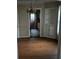 A dining room featuring built-in shelves, hardwood floors, and a chandelier at 1643 Westhaven Sw Dr, Atlanta, GA 30311