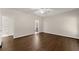 Spacious bedroom with hardwood floors, ample natural light, and neutral tones, creating a peaceful and comfortable environment at 3040 Larkspur Ct, Cumming, GA 30041