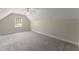 Bedroom featuring neutral walls, plush carpet, ceiling fan, and a window with natural light at 3040 Larkspur Ct, Cumming, GA 30041