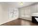 Breakfast nook with wood floors, bright windows, and a view of the kitchen's modern cabinetry and countertops at 3040 Larkspur Ct, Cumming, GA 30041