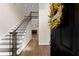Inviting entryway with wood flooring, a staircase with iron railings, and view into the cozy living room at 3040 Larkspur Ct, Cumming, GA 30041