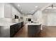 Modern kitchen features white cabinets, stainless steel appliances, and a large island, perfect for entertaining at 3040 Larkspur Ct, Cumming, GA 30041