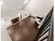 Open concept view from above shows a fireplace, hardwood floors, and the modern kitchen, creating an inviting atmosphere at 3040 Larkspur Ct, Cumming, GA 30041