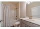 Bright bathroom featuring a shower and tub combination and a large single vanity at 3080 Westpoint Cir, Snellville, GA 30078