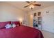 Bedroom featuring a ceiling fan, a large window, and comfortable furnishings at 3080 Westpoint Cir, Snellville, GA 30078
