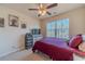 Cozy bedroom with a ceiling fan, a large window, and comfortable furnishings at 3080 Westpoint Cir, Snellville, GA 30078