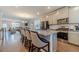 Modern kitchen with granite countertops, stainless steel appliances, and a breakfast bar, ideal for casual dining at 3080 Westpoint Cir, Snellville, GA 30078