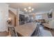 Inviting living room with a comfortable seating area, a view to the stairwell, and a large table at 3080 Westpoint Cir, Snellville, GA 30078