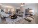 Relaxing open concept living room with neutral decor and an open view to kitchen and dining area at 3080 Westpoint Cir, Snellville, GA 30078