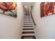 Elegant stairway with hardwood steps and handrail, adding a touch of sophistication to the home's interior at 3080 Westpoint Cir, Snellville, GA 30078