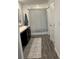 Clean bathroom featuring a vanity, mirror, and shower with a striped curtain at 409 Ruths Blvd, Woodstock, GA 30188