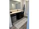 Well-lit bathroom featuring a vanity, mirror, and shower with a striped curtain at 409 Ruths Blvd, Woodstock, GA 30188