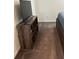 Bedroom with entertainment system, including a TV and wood shelf at 409 Ruths Blvd, Woodstock, GA 30188