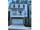 Charming two-story home with a stone-accented garage and cozy front porch at 409 Ruths Blvd, Woodstock, GA 30188