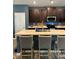 The kitchen features a large island with barstool seating, stainless steel appliances, and rich cabinetry at 409 Ruths Blvd, Woodstock, GA 30188